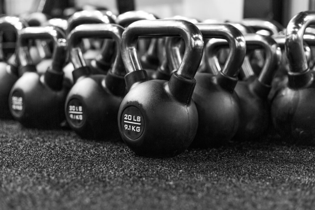 a row of kettles lined up in a gym